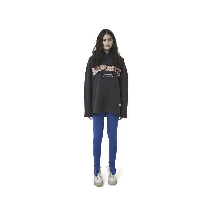 Classic leggings in blue fabric featuring Eighteen Eighty-Six logo patch sewn at Elastic waistband. Open at ankle cuffs.