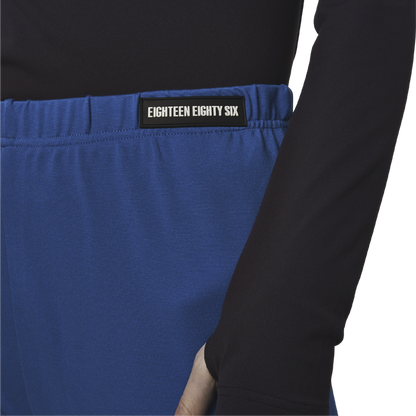 Classic leggings in blue fabric featuring Eighteen Eighty-Six logo patch sewn at Elastic waistband. Open at ankle cuffs.