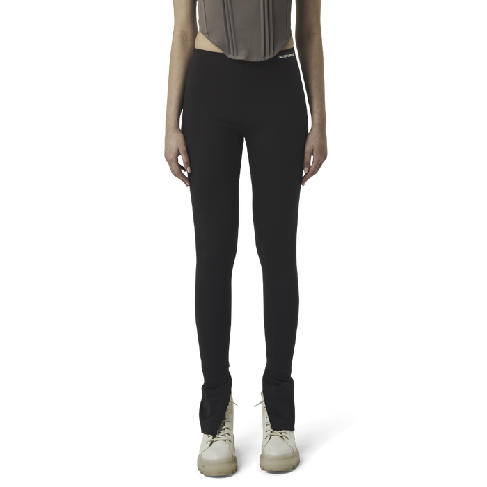 Classic leggings in coffee brown fabric featuring Eighteen Eighty-Six logo patch sewn at Elastic waistband. Open at ankle cuffs.