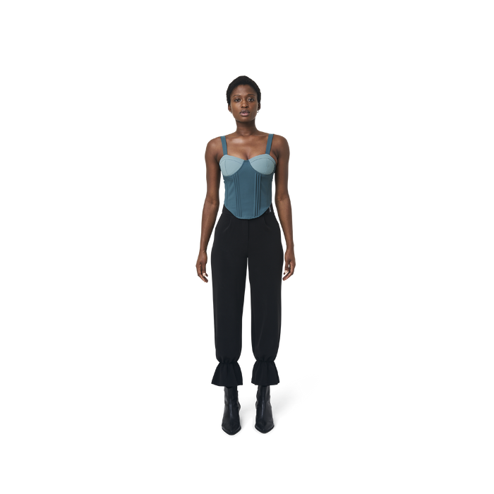 Cropped corset top in mix blue fabric color featuring lines details at front. logo patch sewn at Scoop neck. Full zipper at back.