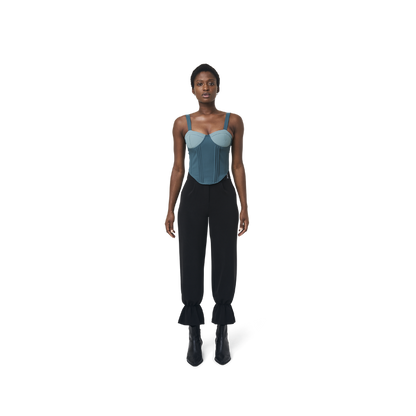 Cropped corset top in mix blue fabric color featuring lines details at front. logo patch sewn at Scoop neck. Full zipper at back.