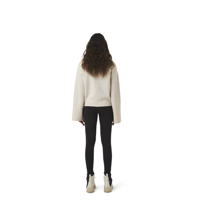 Long sleeves highneck cut wool sweater in beige color fabric featuring 1886 logo embroidered at bottom front. Loose at cuffs and hem.