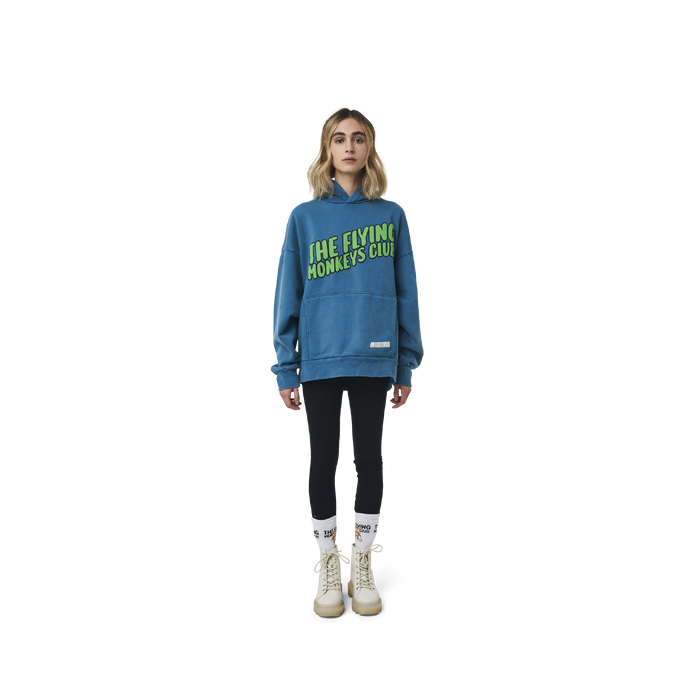 Long sleeves oversize cut hoodie in washed sapphire blue color fabric featuring  ' The Flying Monkeys Club ' logo print at front and at back. 1886 logo embroidered at kangaroo pocket. Rib knit at cuffs and hem.
