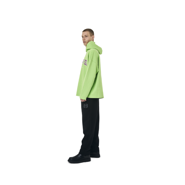 Long sleeves Loose cut hoodie in neon green color fabric featuring Eighteen Eighty-Six print at front. 1886 logo embroidered at bottom front. Loose at cuffs and hem.